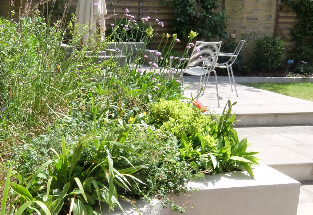 Generous sandstone steps lead to a seating area